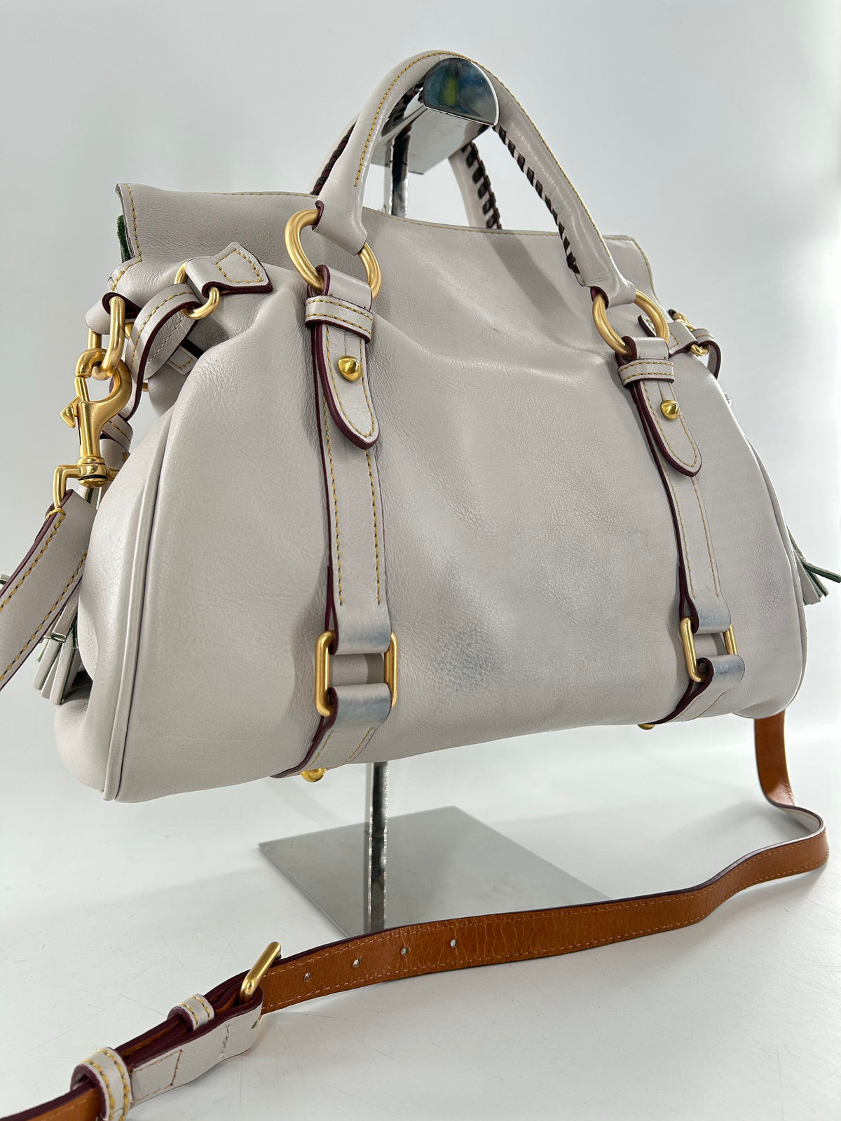 whipstitch handle tassel satchel