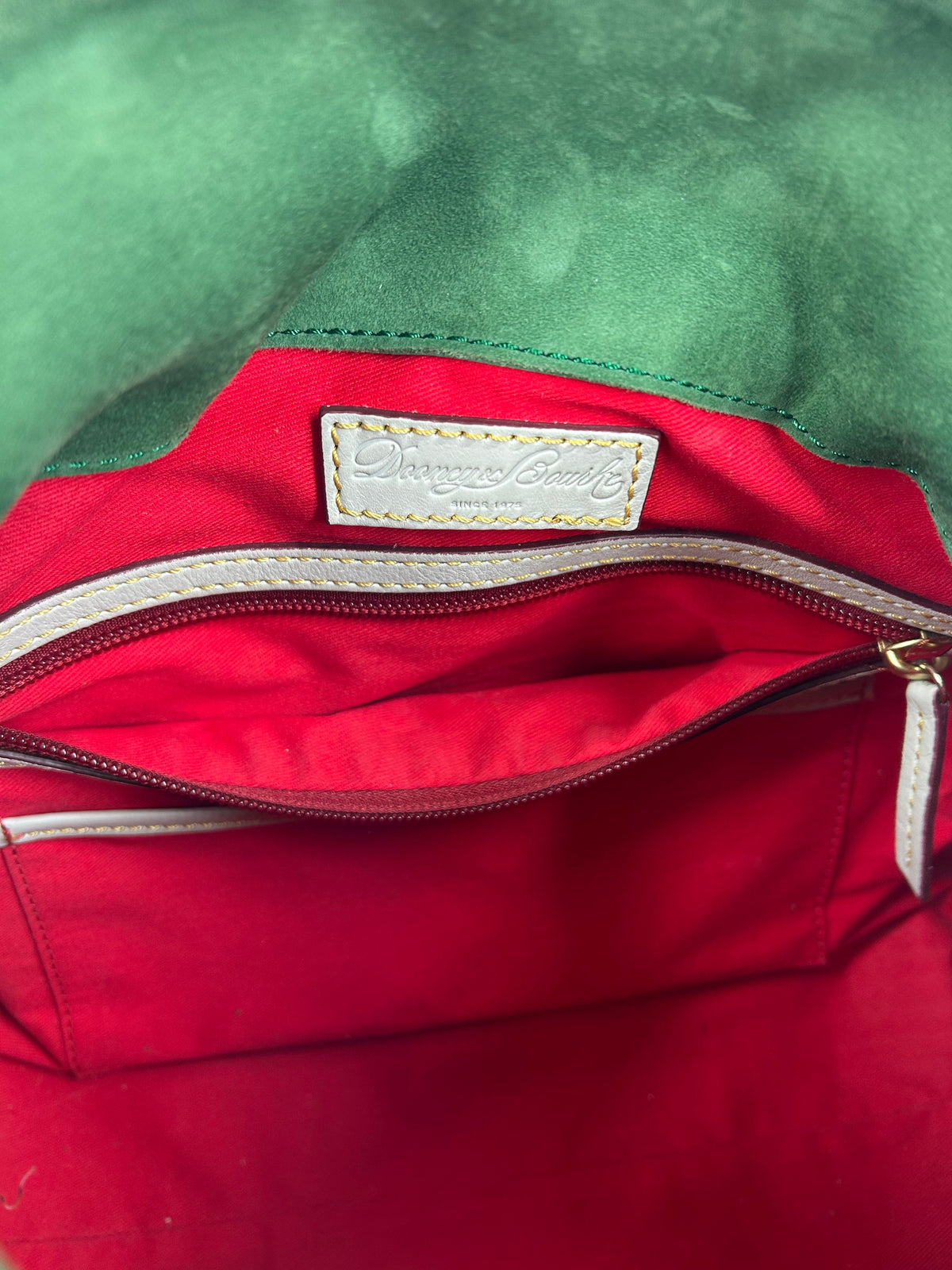 whipstitch handle tassel satchel
