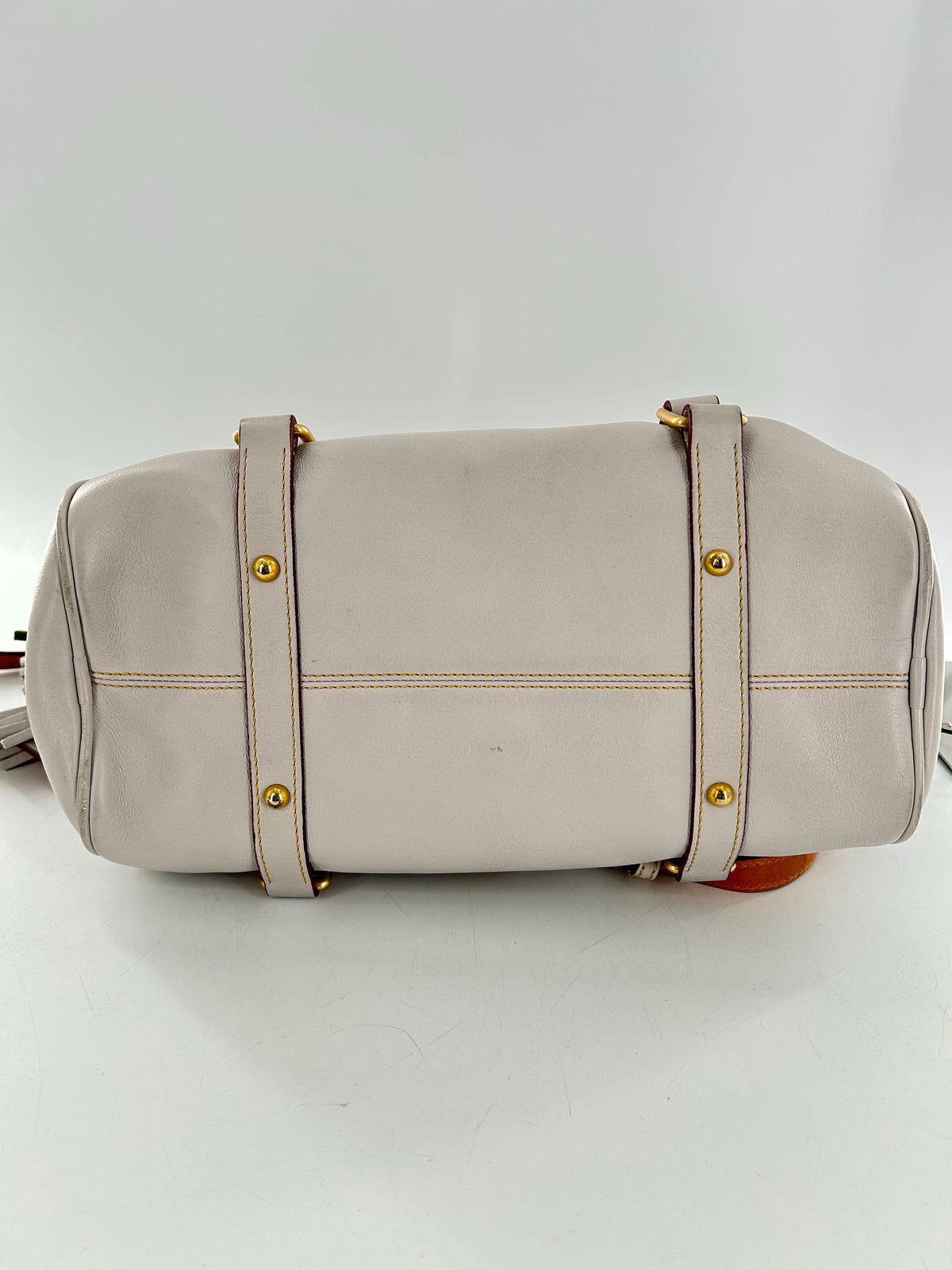 whipstitch handle tassel satchel