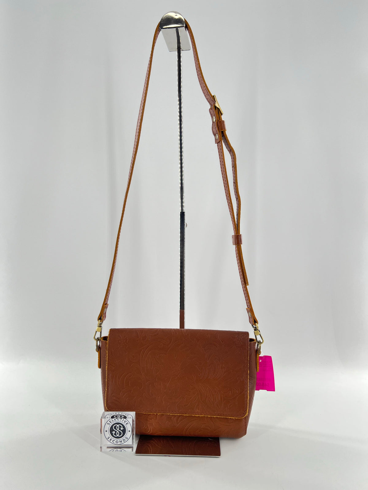 intricate floral & leaf embossed flap crossbody