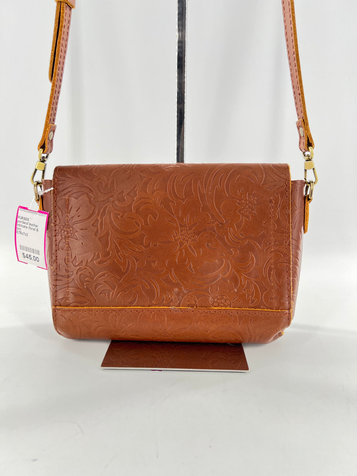intricate floral & leaf embossed flap crossbody
