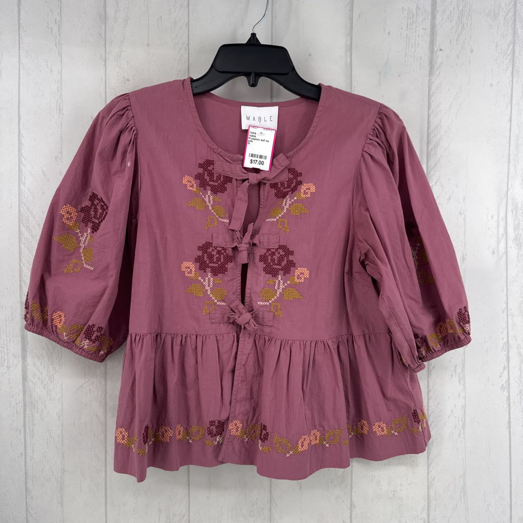 M peplum self tie closure cross-stitch style top